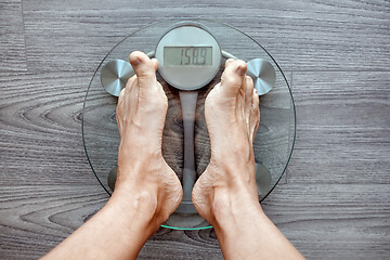 Image showing Human feet on electronic scales