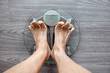 Image showing Human feet on electronic scales