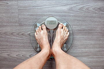 Image showing Human feet on electronic scales