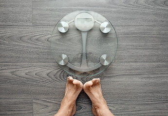 Image showing Human feet on electronic scales