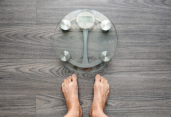 Image showing Human feet on electronic scales