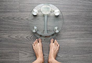 Image showing Human feet on electronic scales