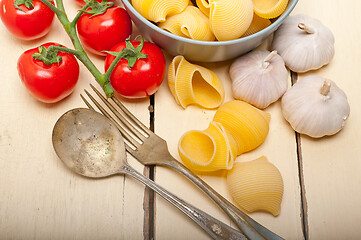 Image showing Italian snail lumaconi pasta with tomatoes