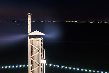 Image showing Smoke coming from the chimney, long exposure at night