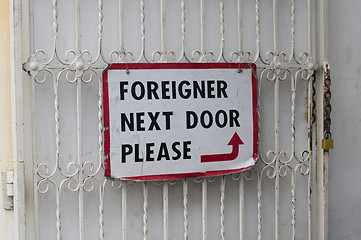 Image showing foreigner next door please