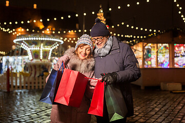 Image showing old couple at christmas market with shopping bags