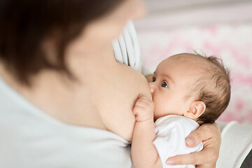 Image showing close up of mother breastfeeding newborn baby