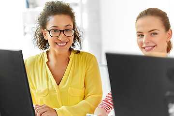 Image showing happy high school students in computer class