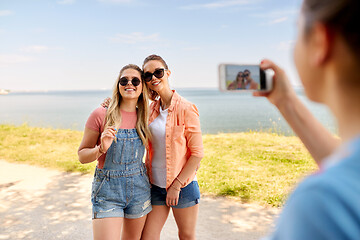 Image showing teenage girls or best friends being photographed