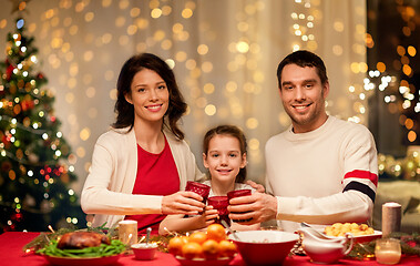 Image showing happy family having christmas dinner at home