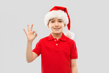 Image showing smiling boy in santa helper hat showing ok gesture