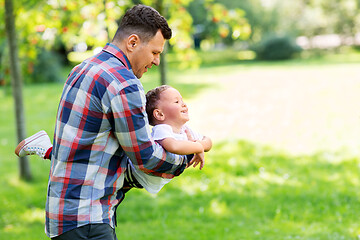 Image showing happy father with son playing in summer park