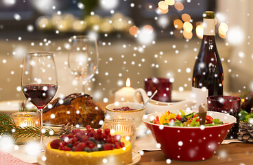 Image showing food and drinks on christmas table at home