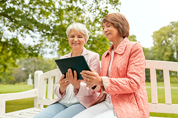 Image showing senior women with tablet pc at summer park