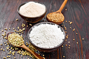 Image showing Flour buckwheat green and brown in bowls on dark wooden board