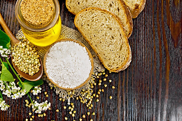 Image showing Flour buckwheat green in bowl with bread on dark board top