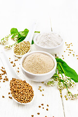 Image showing Flour buckwheat brown and green in bowls on light board