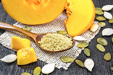 Image showing Flour pumpkin in spoon on board