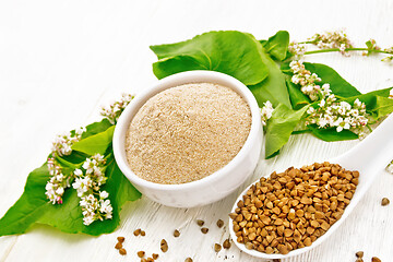 Image showing Flour buckwheat brown in bowl on board