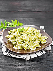 Image showing Farfalle with pesto in plate on table