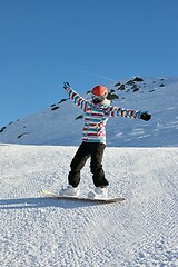 Image showing Female snowboarder in the Alps