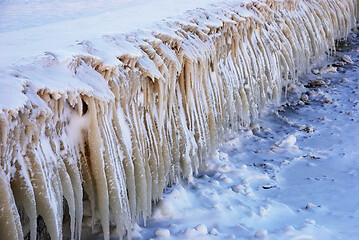 Image showing rows of icicles on the embankment