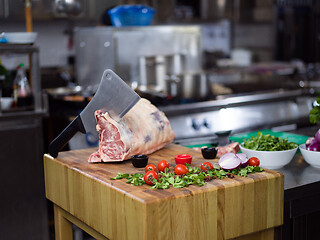 Image showing chef cutting big piece of beef