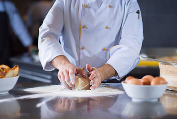 Image showing chef hands preparing dough for pizza