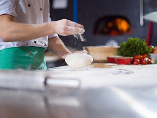 Image showing chef hands preparing dough for pizza