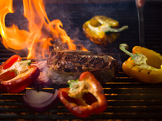 Image showing steak with vegetables on a barbecue