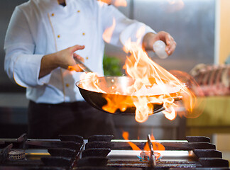 Image showing Chef doing flambe on food