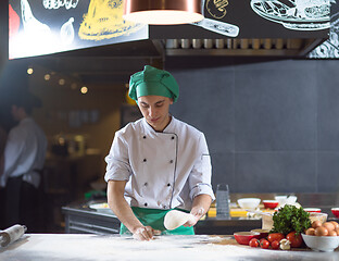 Image showing chef hands preparing dough for pizza