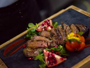 Image showing Chef finishing steak meat plate