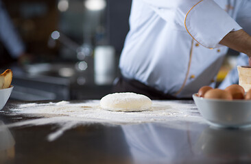 Image showing chef hands preparing dough for pizza