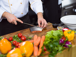 Image showing Chef hands preparing marinated Salmon fish