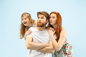 Image showing Happy parent with daughter at studio isolated on blue background