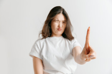 Image showing Woman\'s hand with finger on gray background