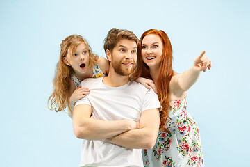 Image showing Happy parent with daughter at studio isolated on blue background