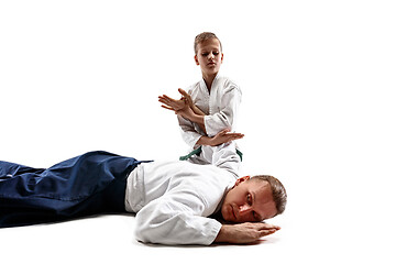 Image showing Man and teen boy fighting at aikido training in martial arts school