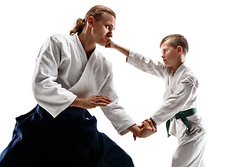 Image showing Man and teen boy fighting at aikido training in martial arts school