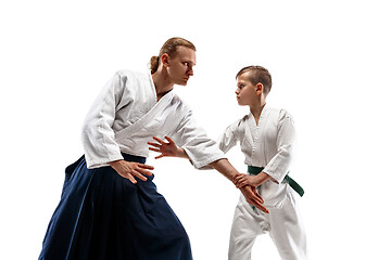 Image showing Man and teen boy fighting at aikido training in martial arts school