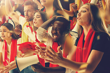 Image showing Group of happy fans are cheering for their team victory.