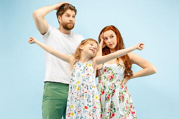 Image showing Happy parent with daughter at studio isolated on blue background