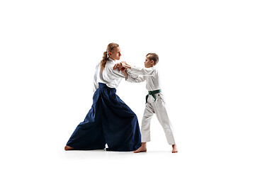 Image showing Man and teen boy fighting at aikido training in martial arts school