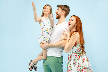 Image showing Happy parent with daughter at studio isolated on blue background
