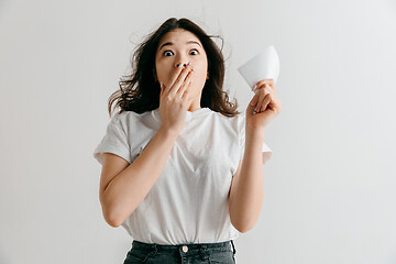 Image showing Young woman with a surprised expression won a bet