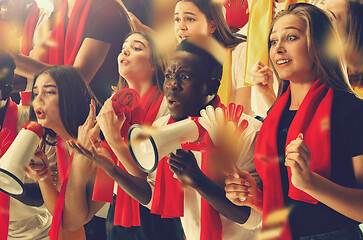 Image showing Group of happy fans are cheering for their team victory.