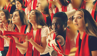 Image showing Group of happy fans are cheering for their team victory.