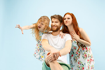 Image showing Happy parent with daughter at studio isolated on blue background