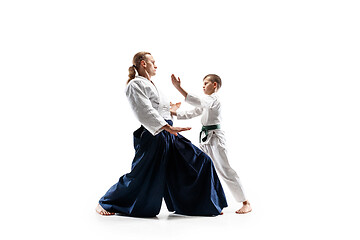 Image showing Man and teen boy fighting at aikido training in martial arts school